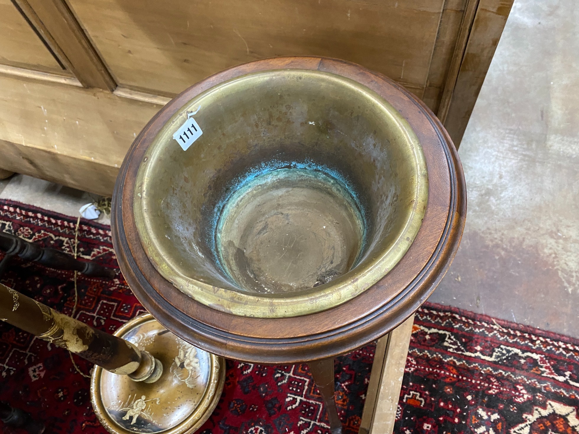 An Edwardian inlaid mahogany jardiniere with brass liner, height 93cm